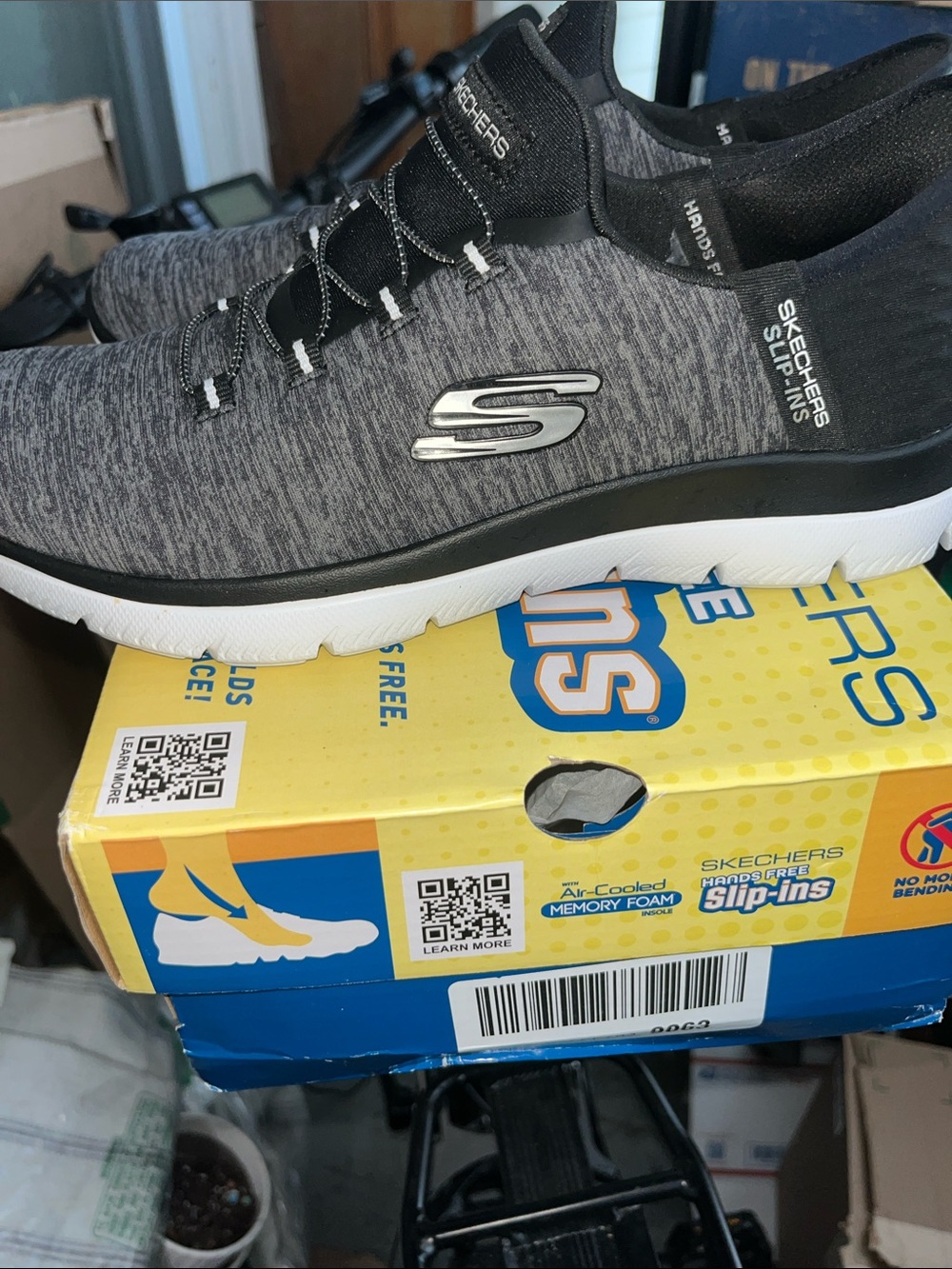 Skechers women’s Gray and Black Slip-On Sneakers